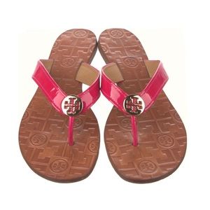 Tory Burch Thora pink patent leather sandals.